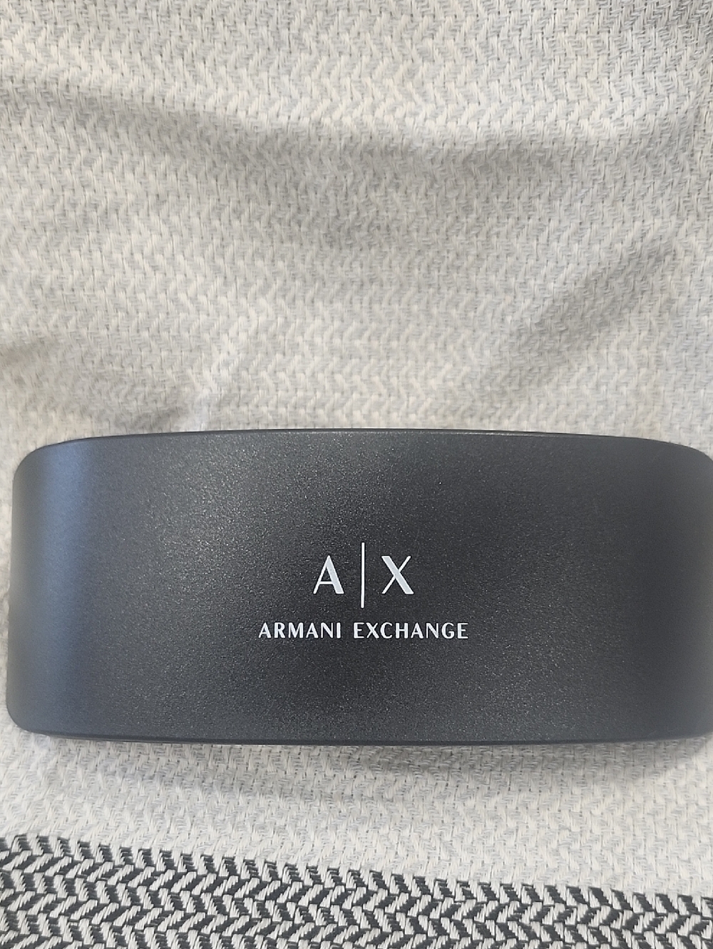 This Armani Exchange A|X black hard clamshell sunglasses or eyeglasses case .